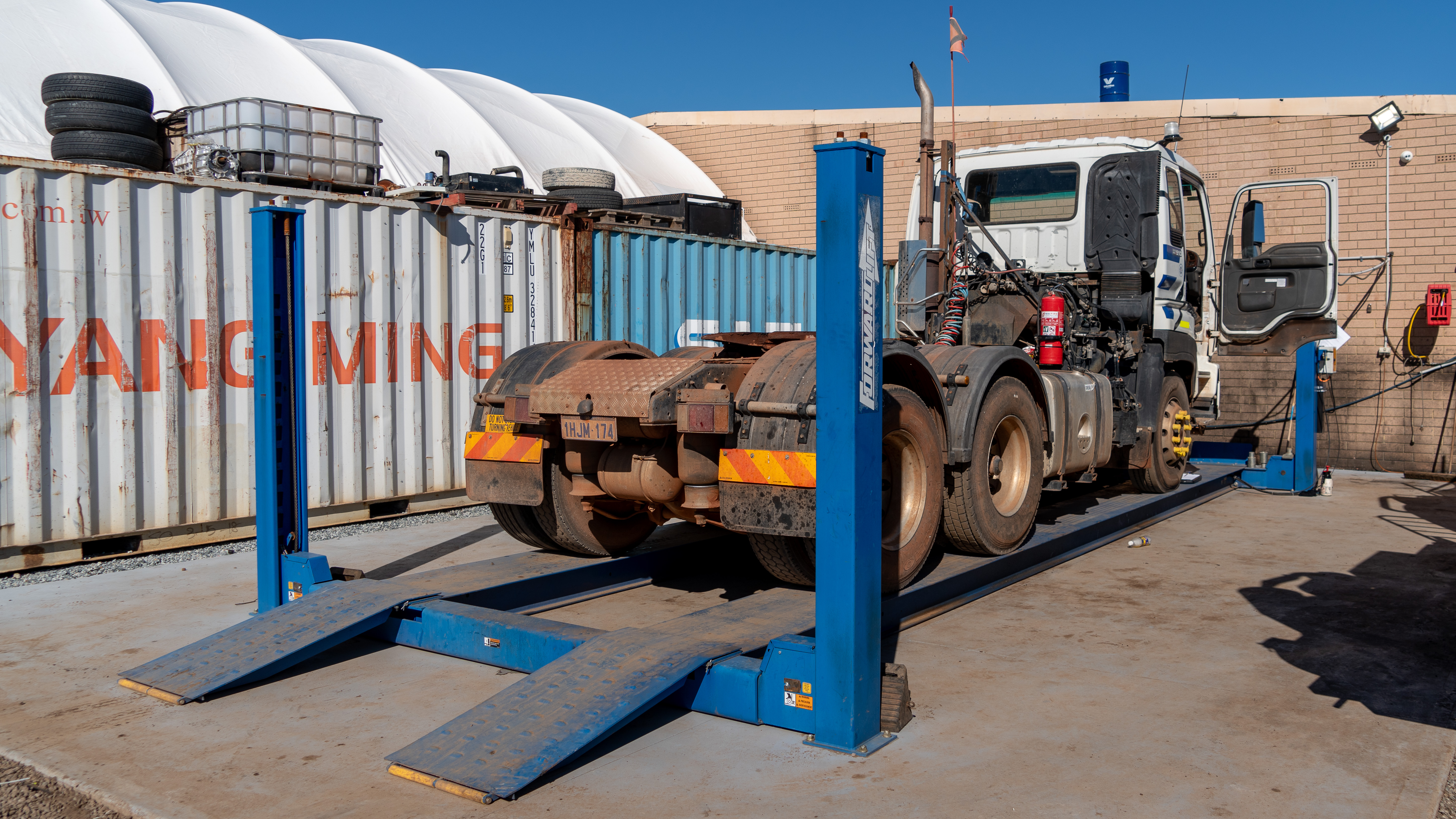 Diesel mechanic inspecting a commercial vehicle